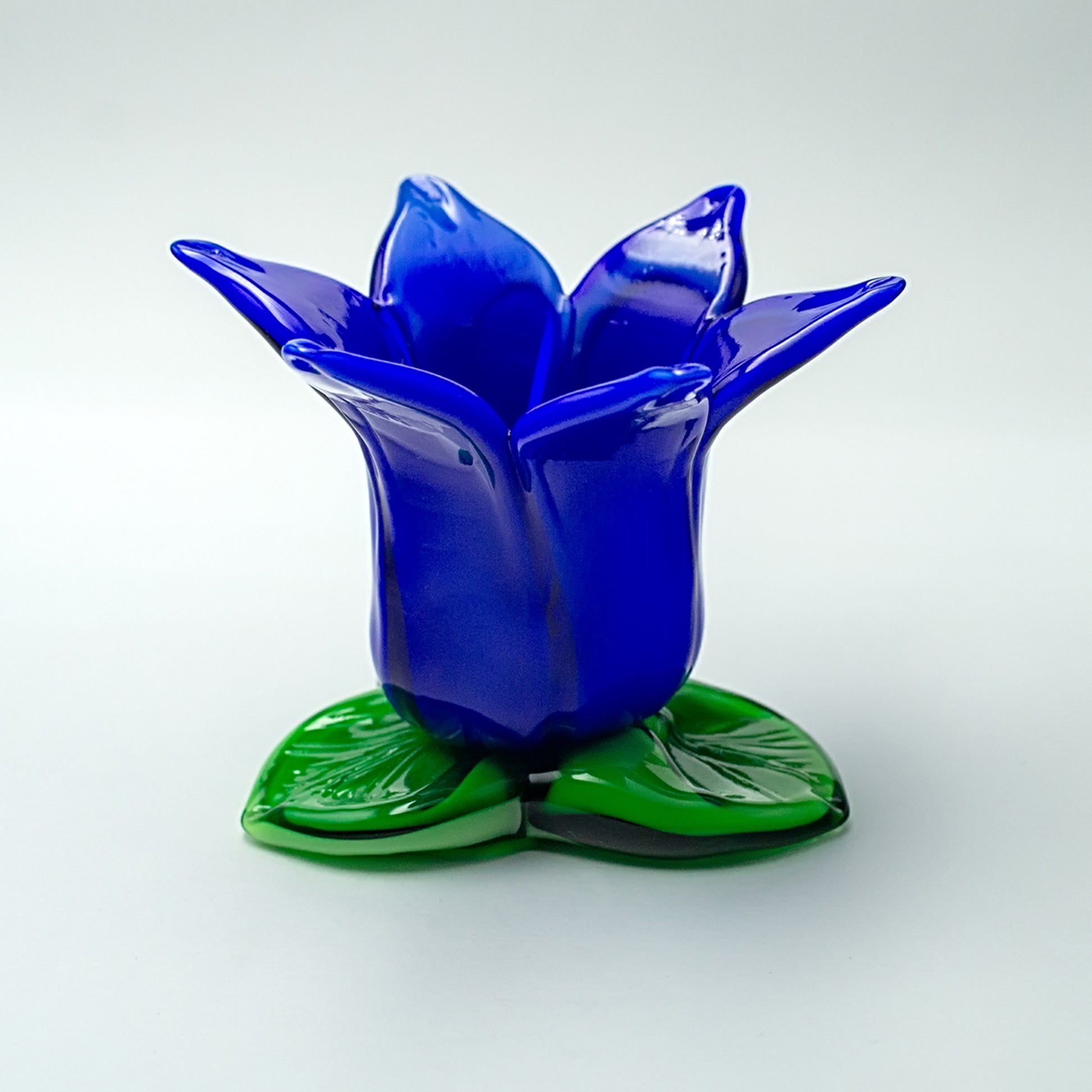 Blue green glass candlestick