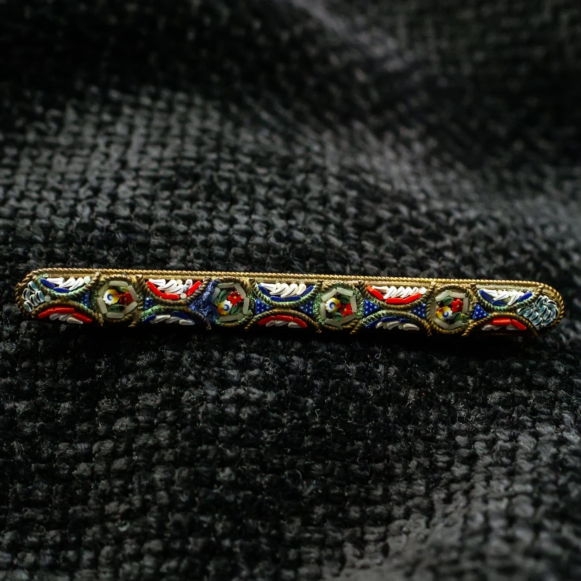 red blue white brooch