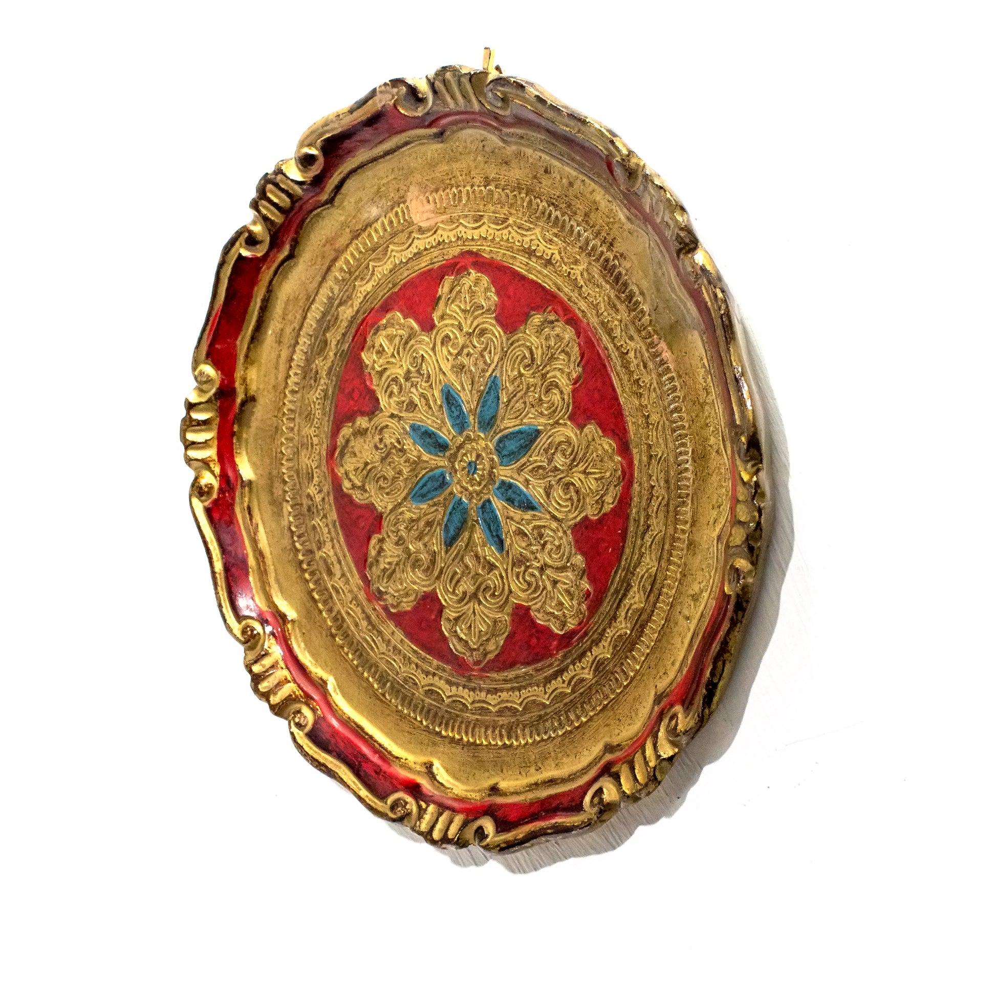 Round Florentine tray hanging on the wall