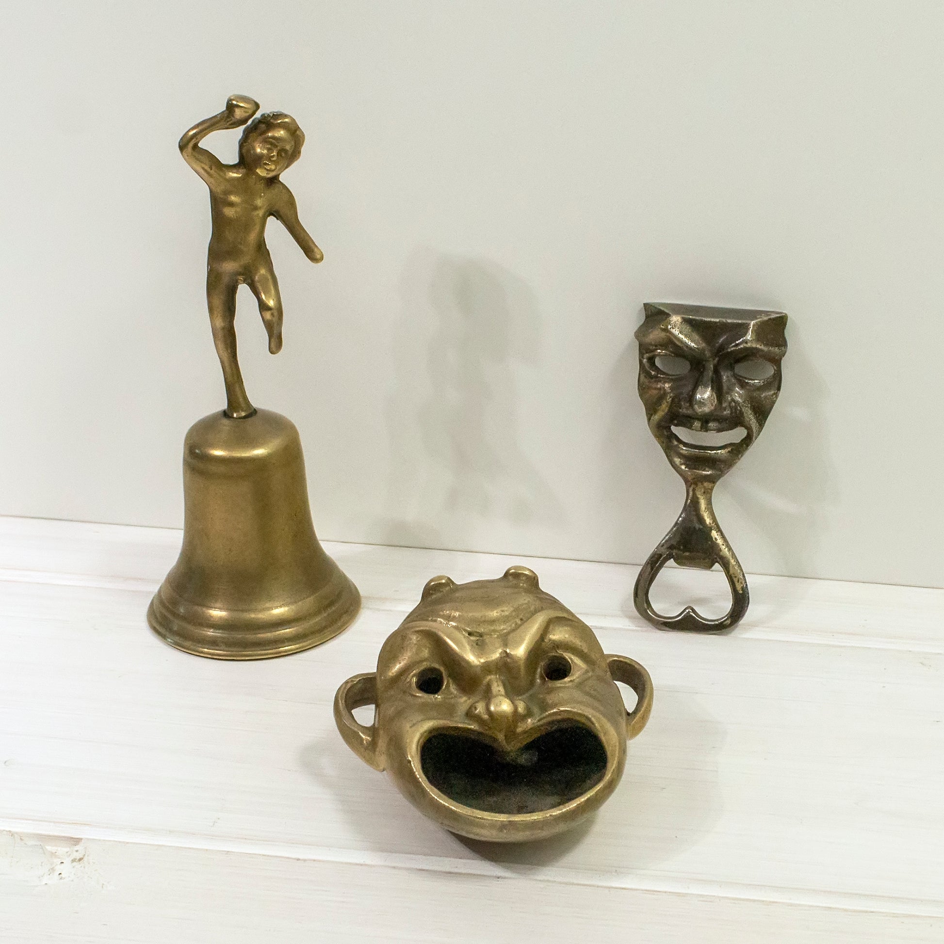 Brass ashtray with other brass items