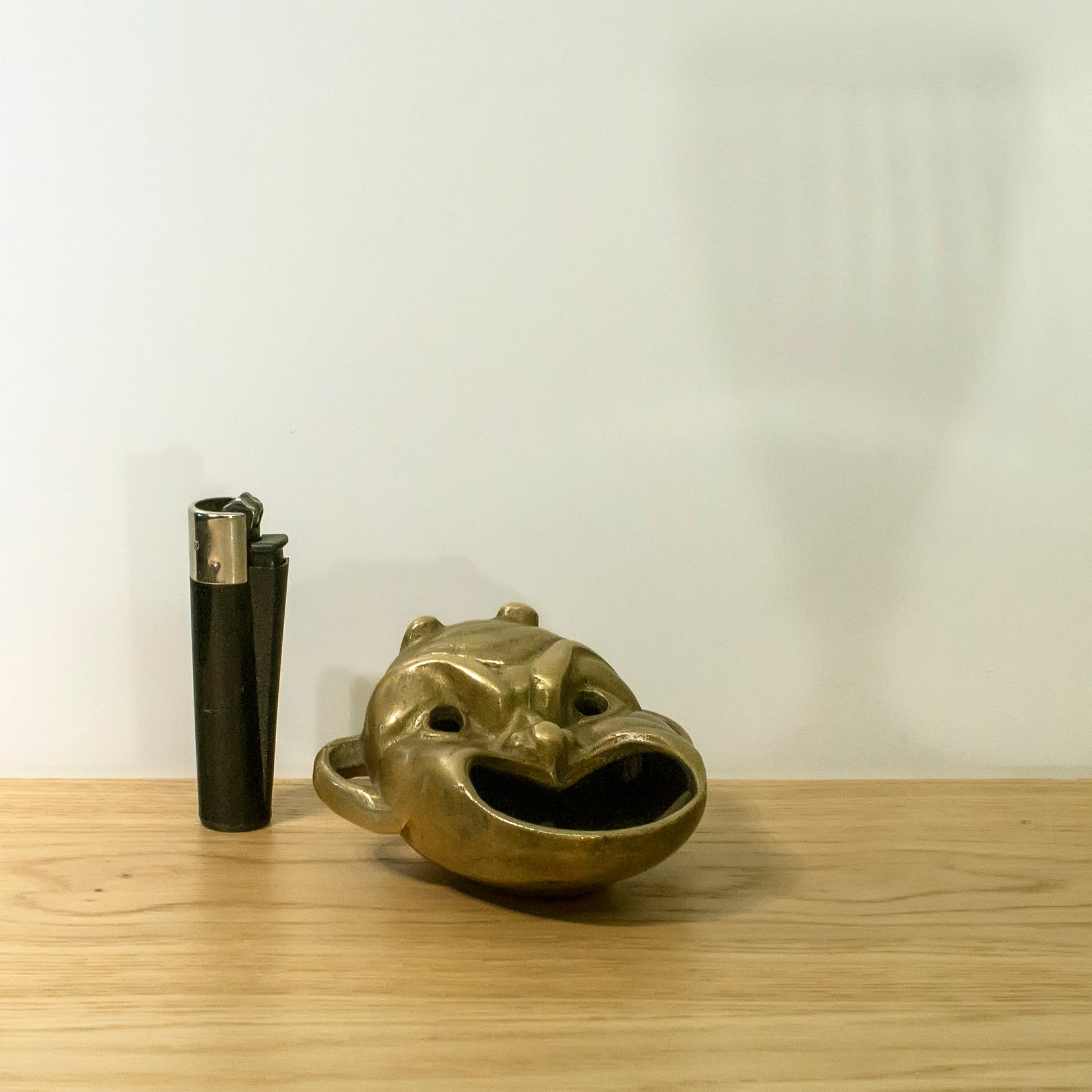 Brass ashtray on the table