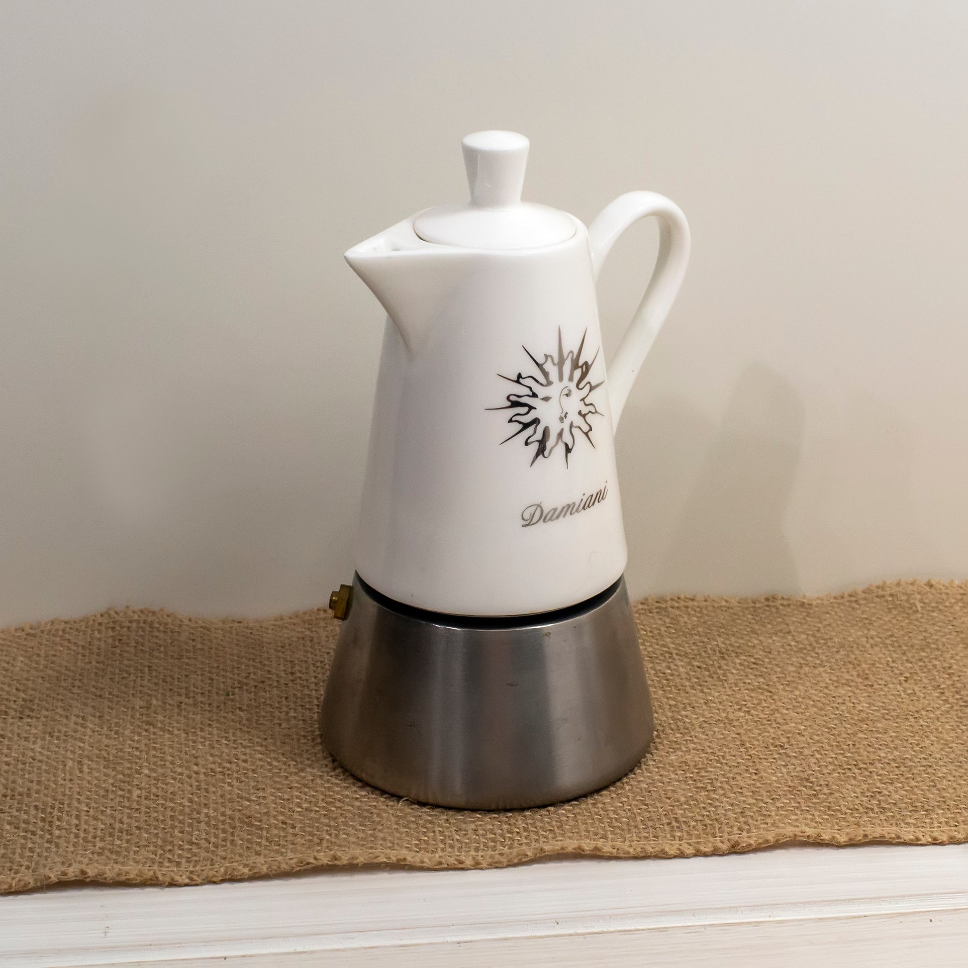 Steel coffee maker with ceramic top