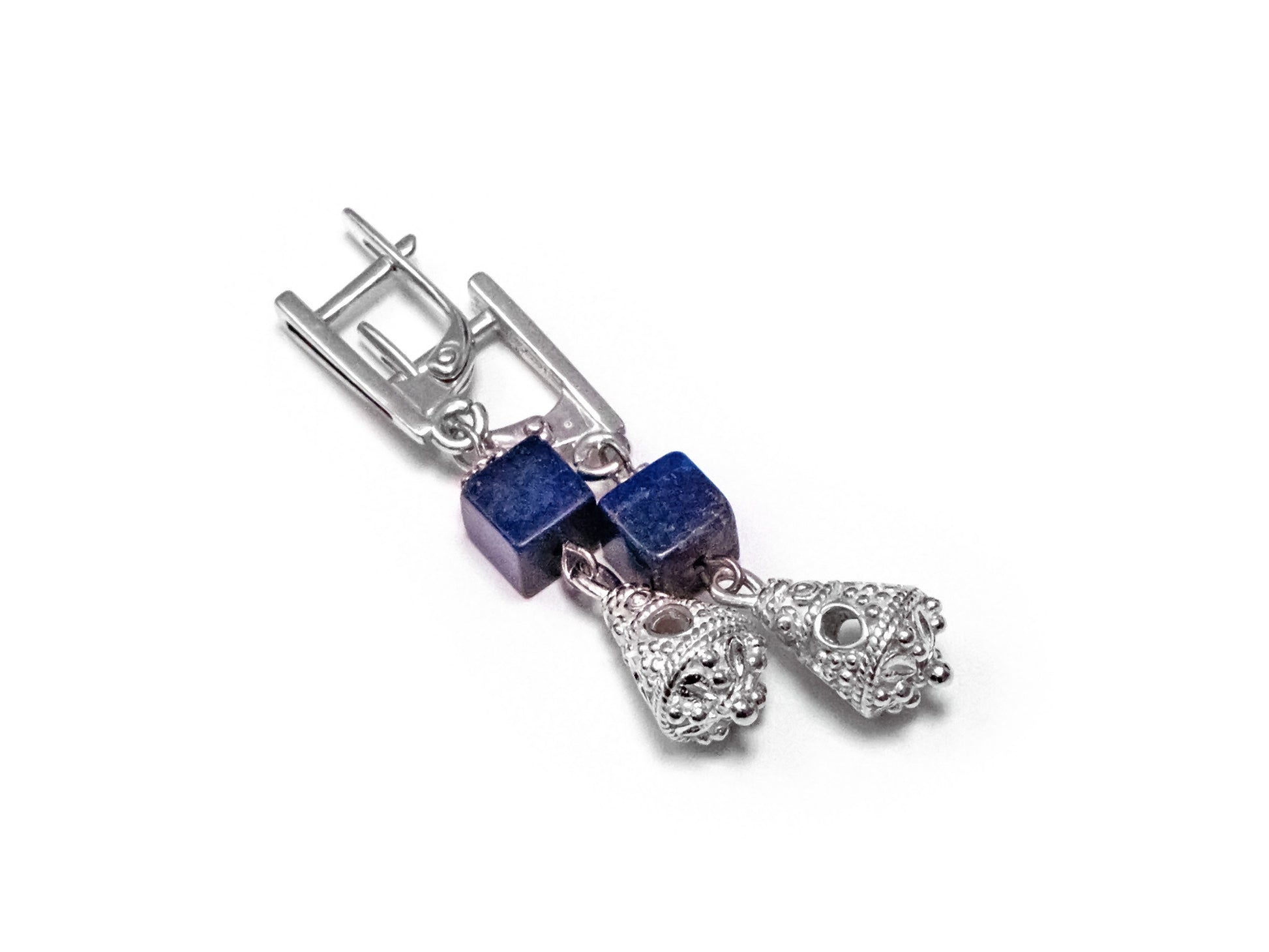 A cube of blue natural polished Afghan lapis lazuli and a finely crafted silver openwork pendant in the form of a bell